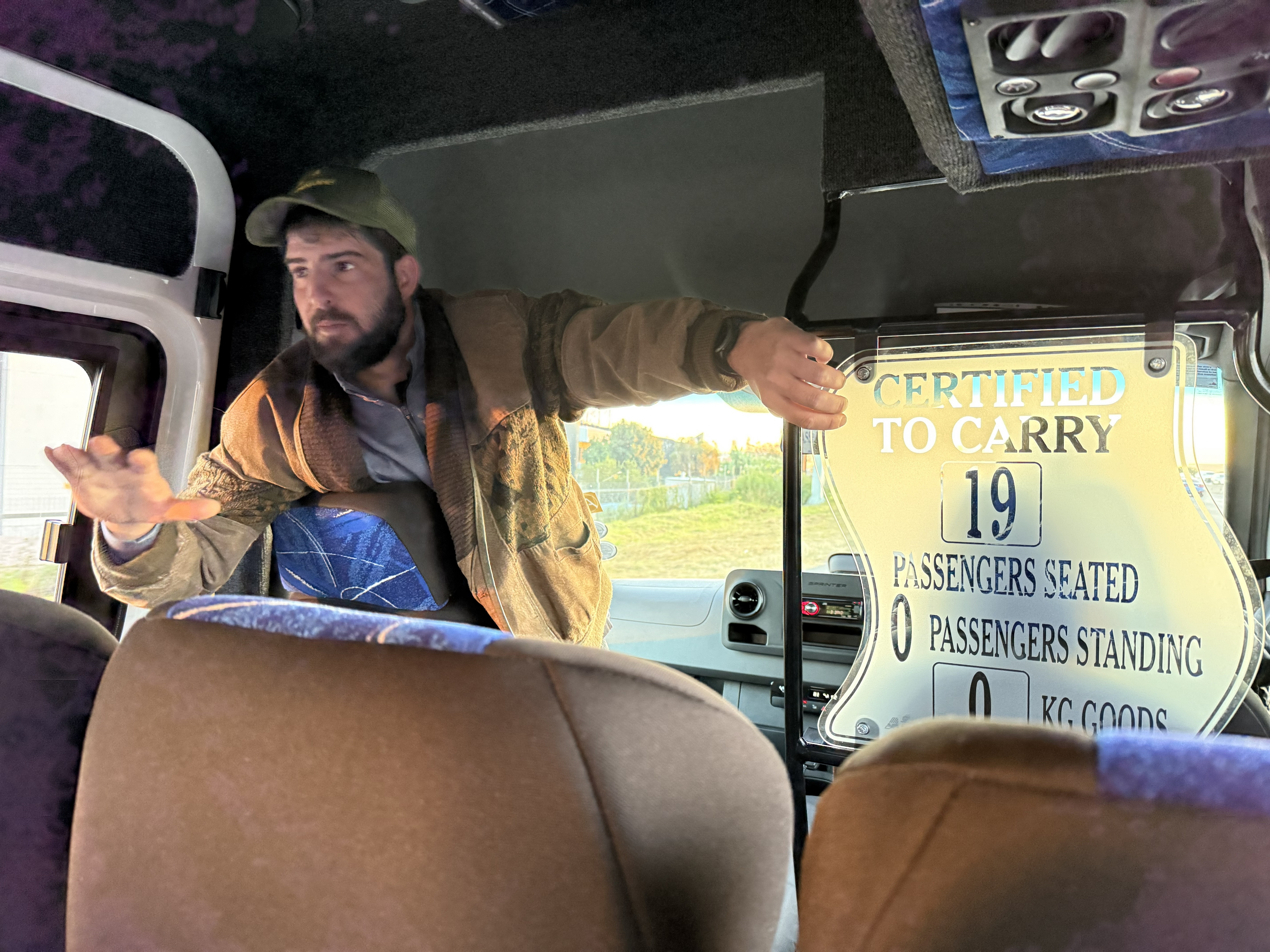 Dylan, on the shuttle bus, telling us what will happen at the airport and the border crossing before it happens. This is most of what a good tour director does: he removes the smal