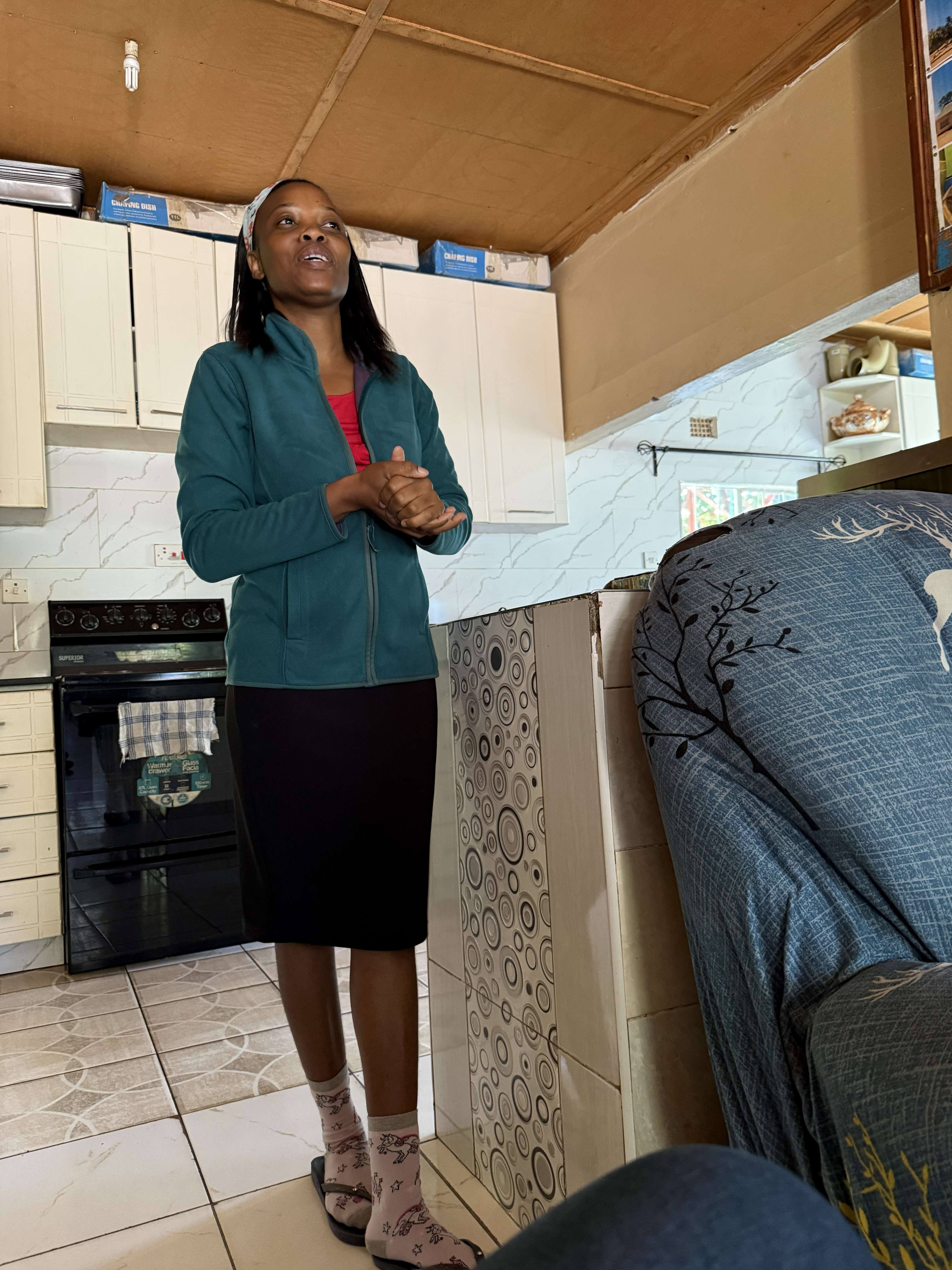 One of the staff, walking us through the work — how the program shelters, feeds, and educates children who have very little, and tries to build something more durable than charity.