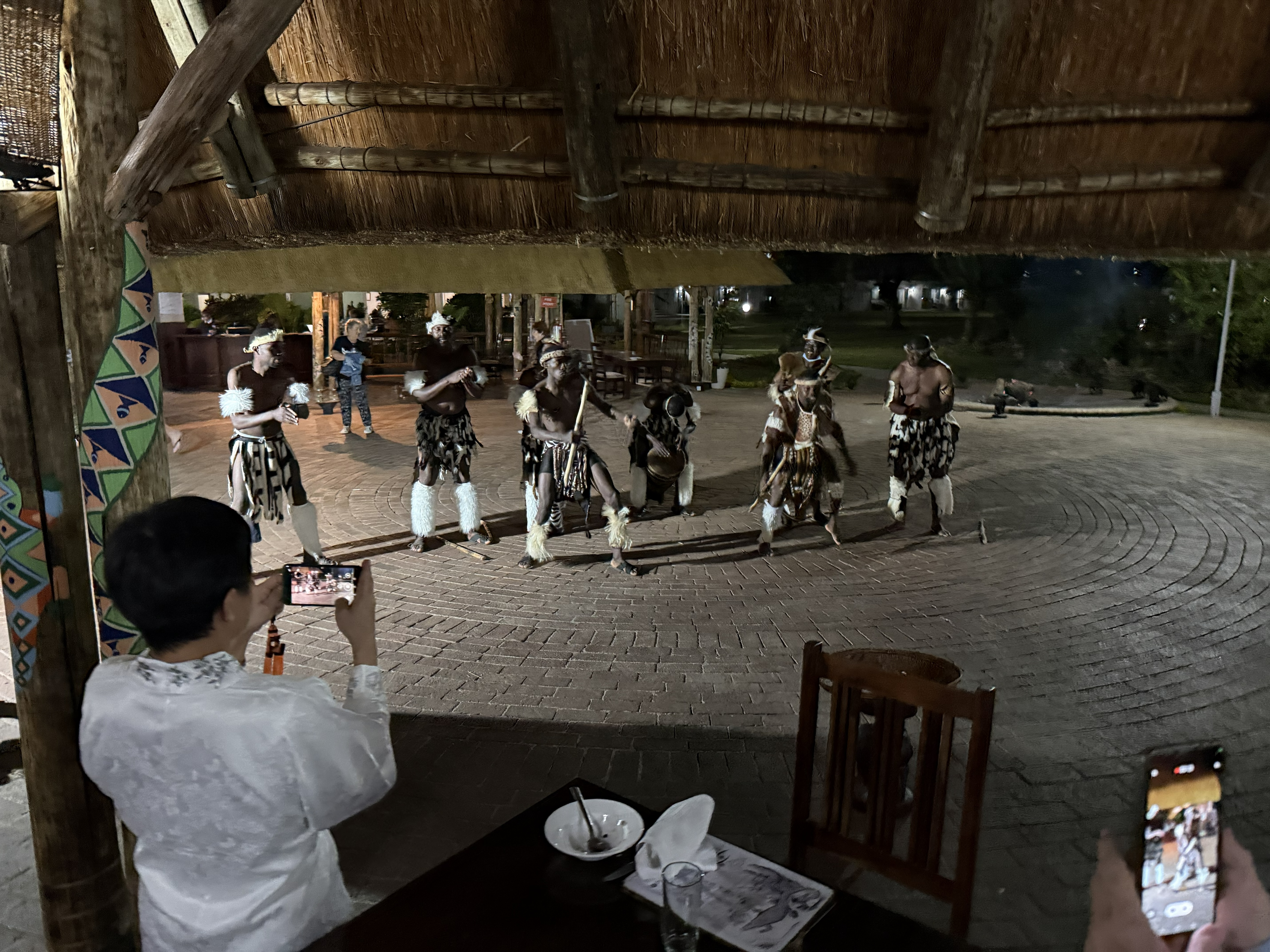 Dancers at dinner. There was something every night — music, performance, movement — and this was the first of them.