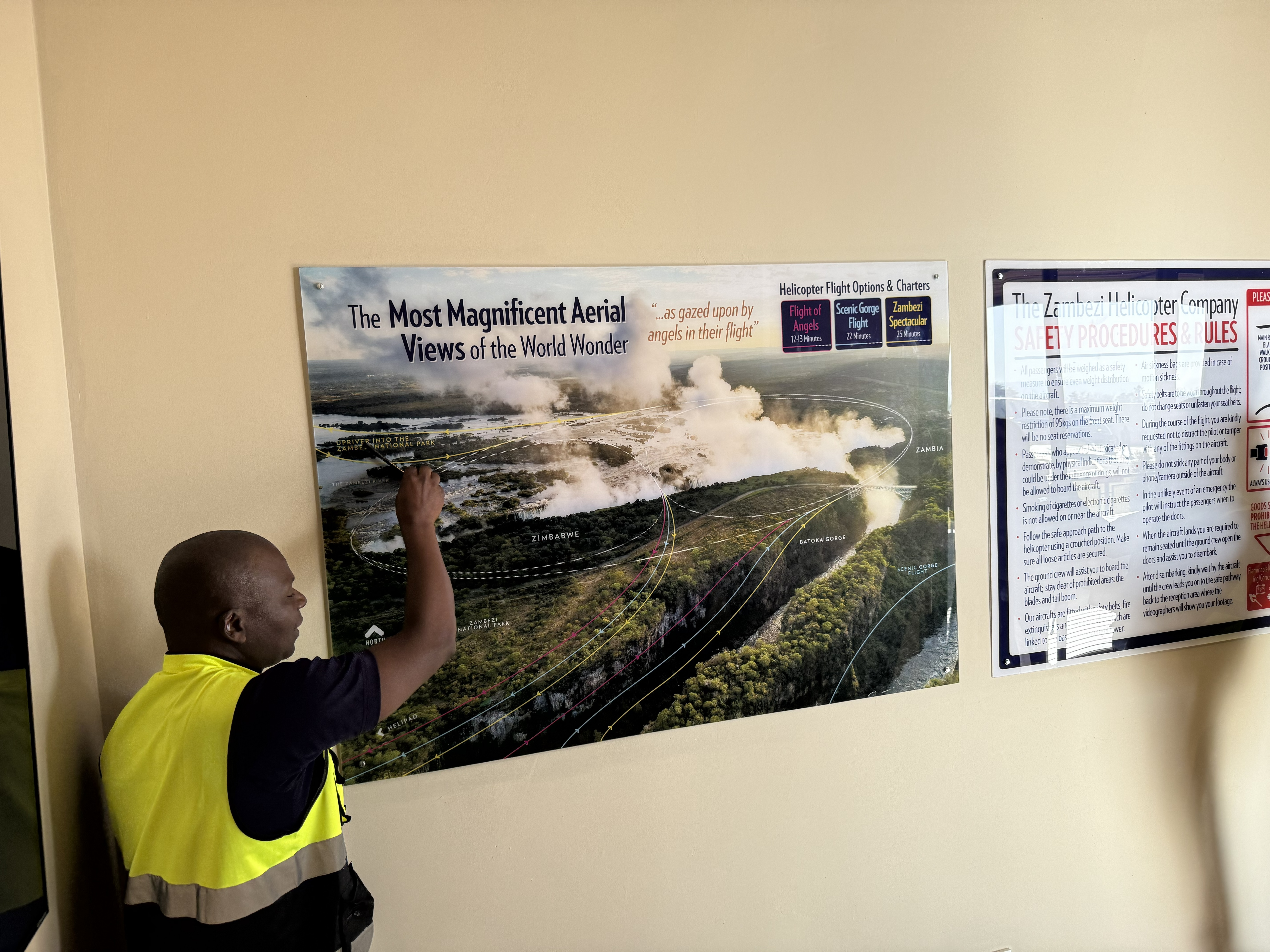 The pre-flight briefing — the guide walking us through the routes the helicopters fly over the falls and the gorge before we boarded.