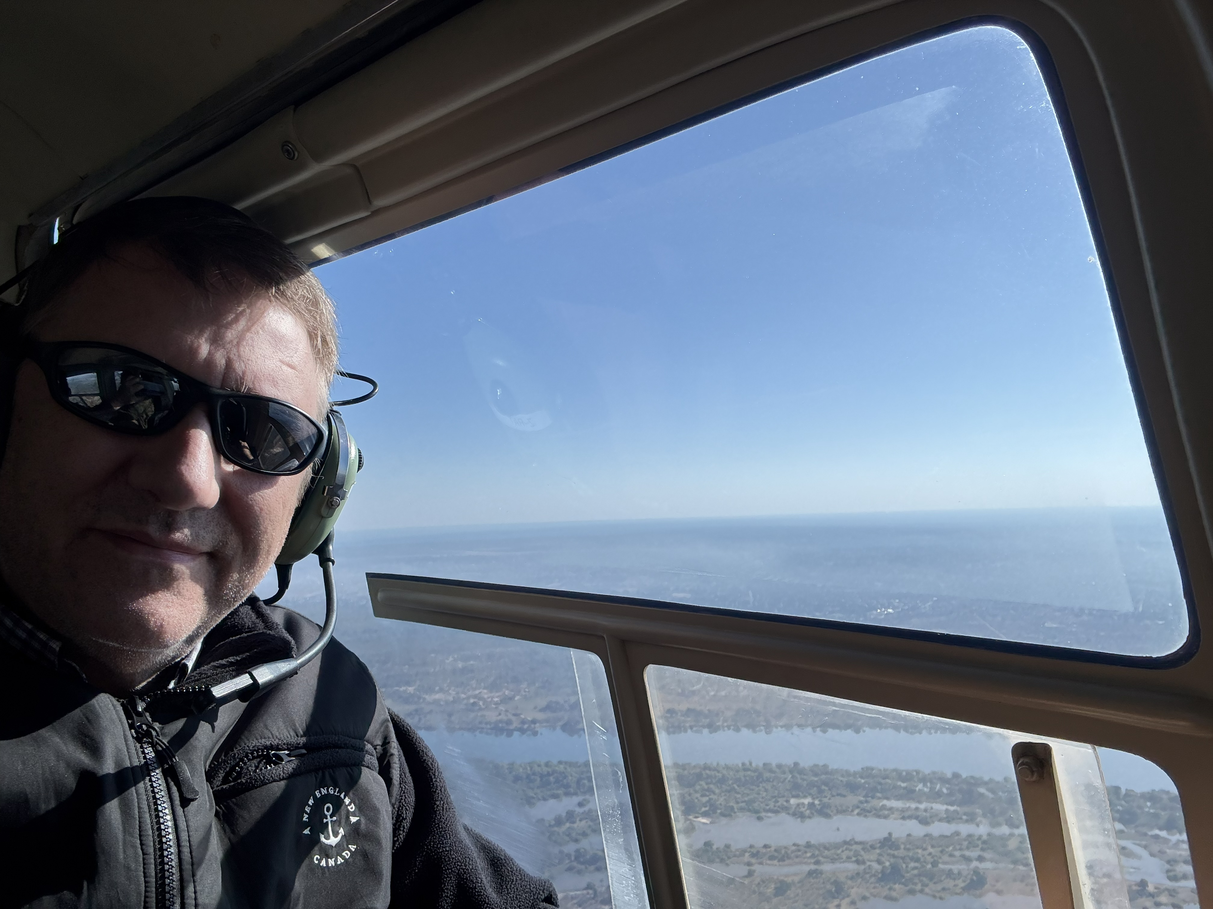 Me, in the back, in the headset, over the Zambezi. There is no way to look cool doing this and I had entirely stopped trying.