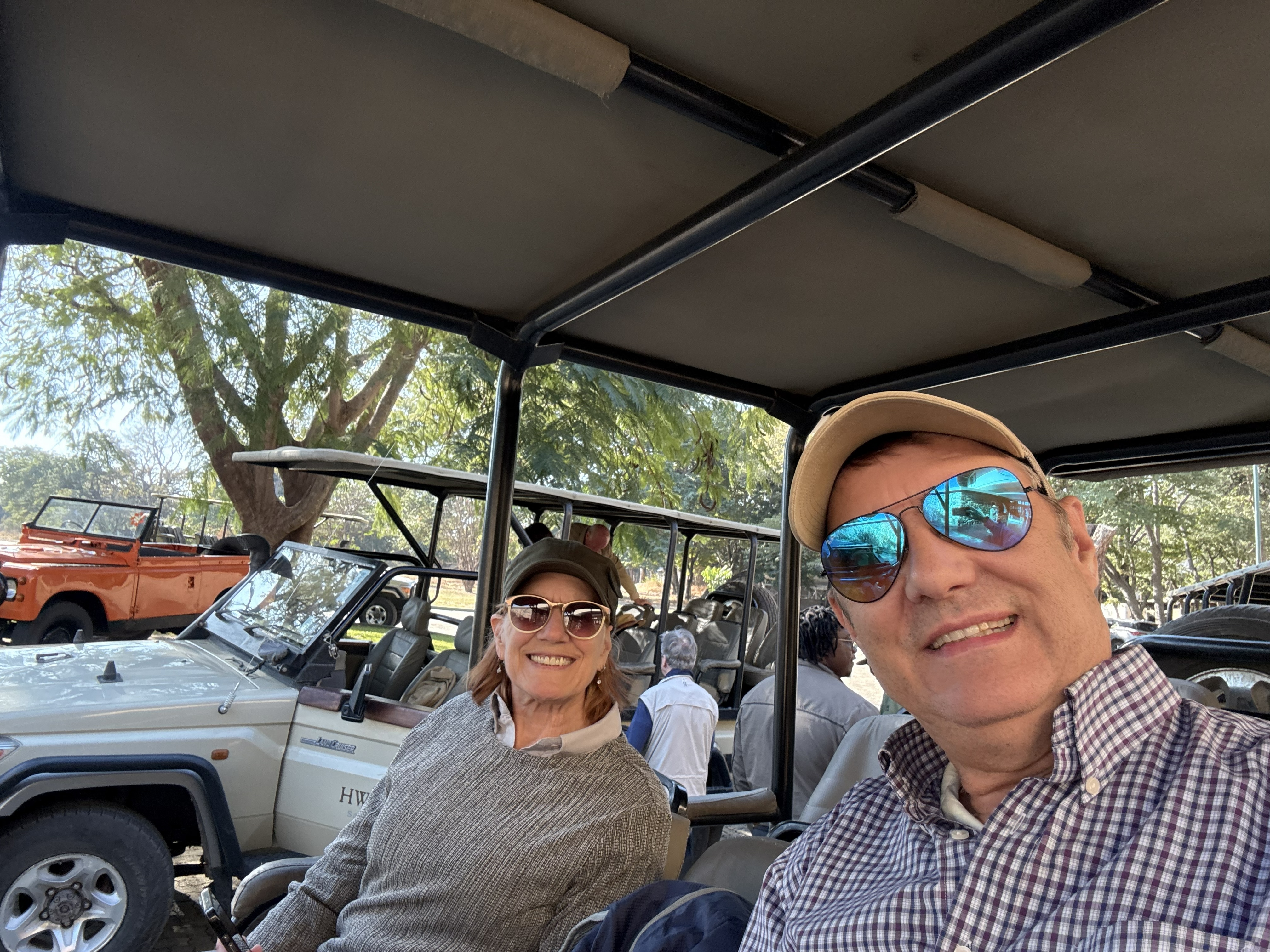 Under the canopy of the safari vehicle, at the start of the afternoon drive. Everyone still clean, still cool, still able to feel their own spine.