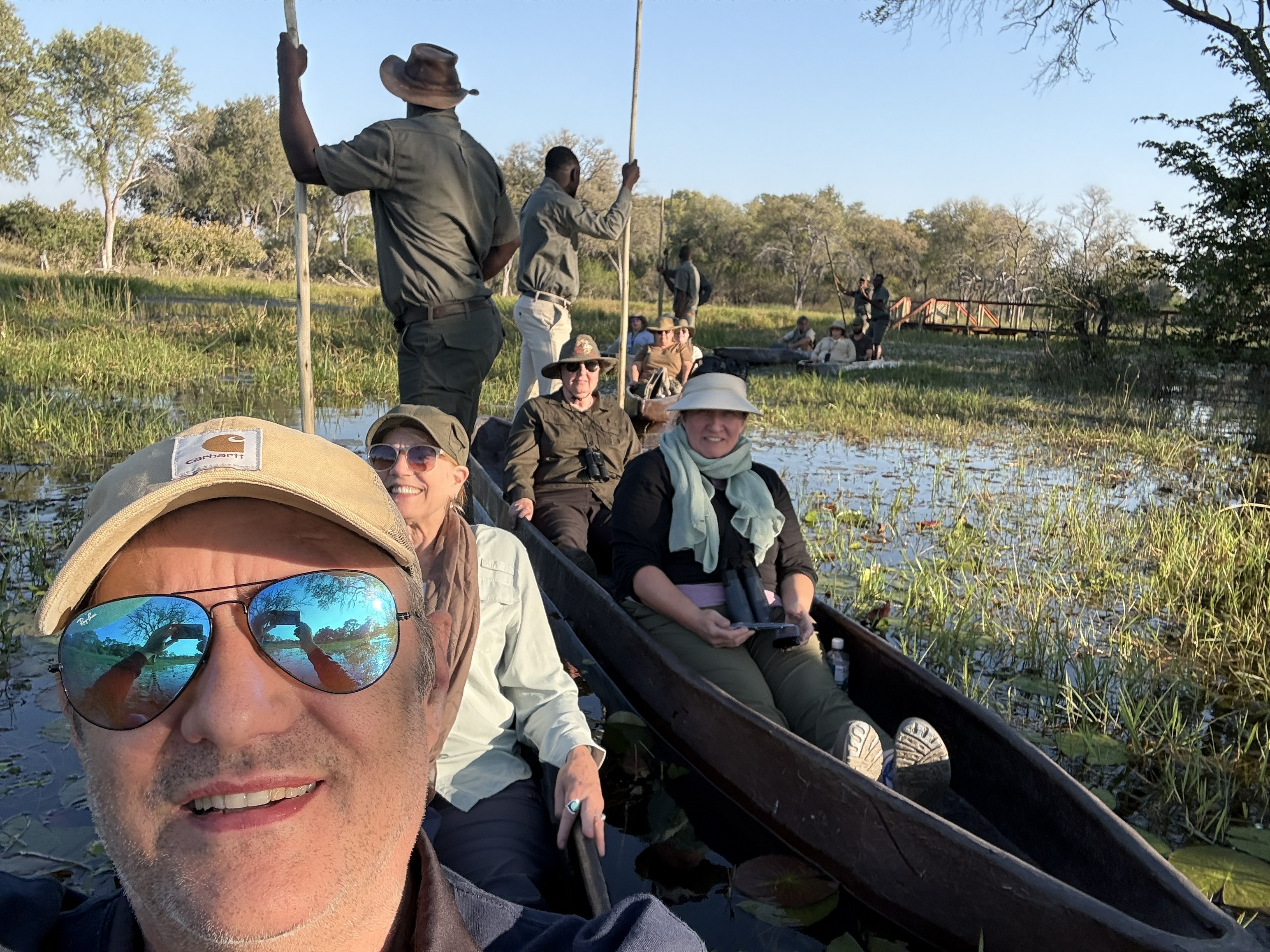 Low in the dugout, poler at the stern, reeds closing in — the Delta's oldest and finest way to travel, at least between hippos.