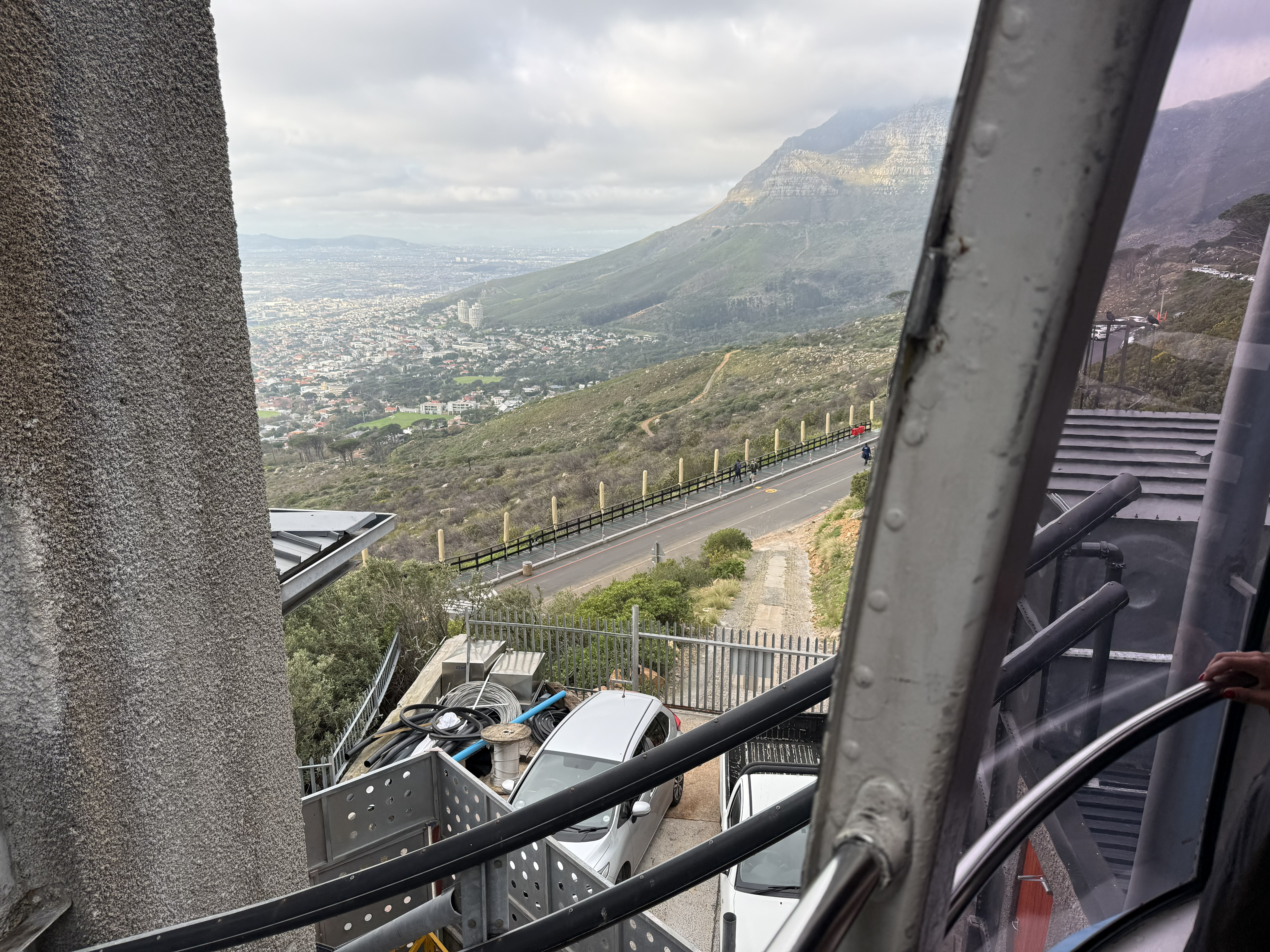 The cableway up, the cables running impossibly steeply toward the rim.