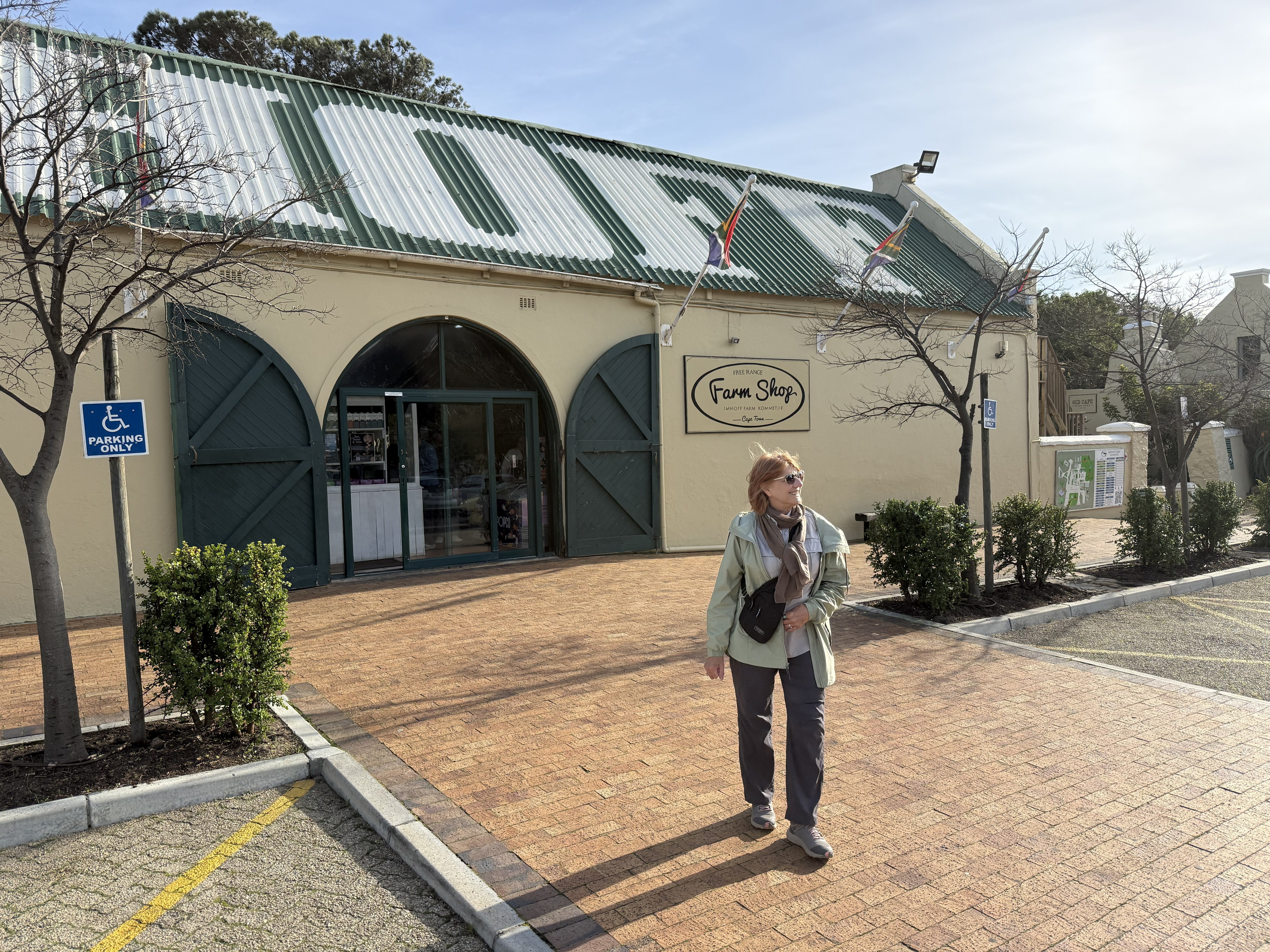 Bonnie coming out of the store — an old building with a long verandah.