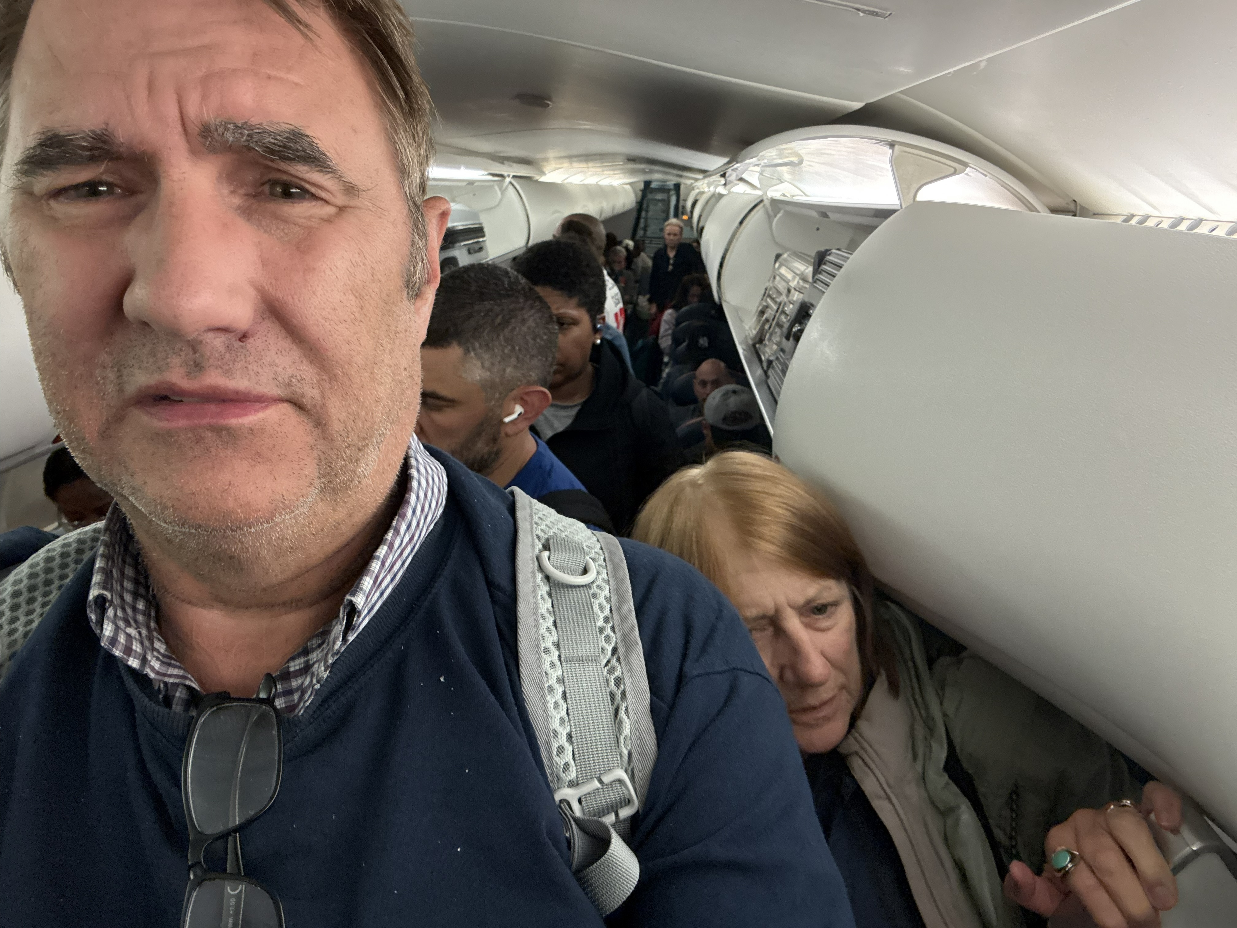 Shuffling off the plane at JFK. This is the face of a man who has been in transit for the better part of thirty hours, and it may be the only entirely honest photograph of air trav